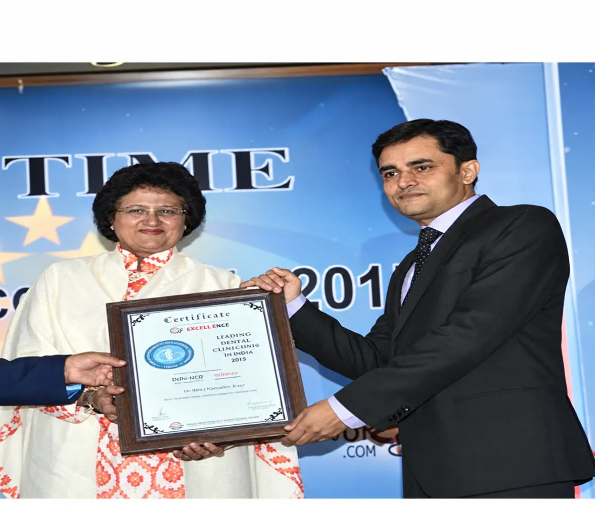 Dental Samagra receiving a certificate of excellence in dentistry